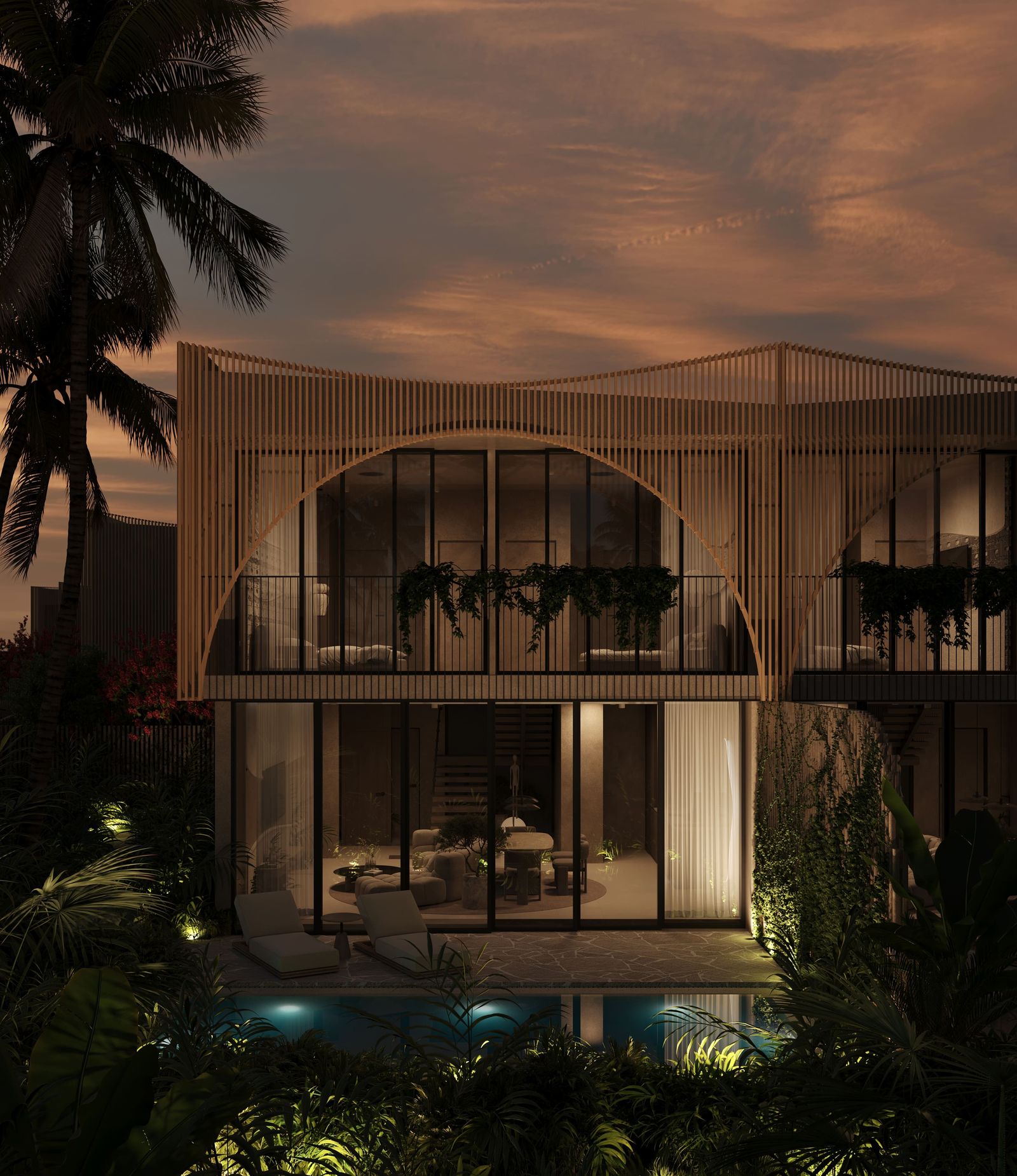 Villa facade with tropical landscaping at dusk